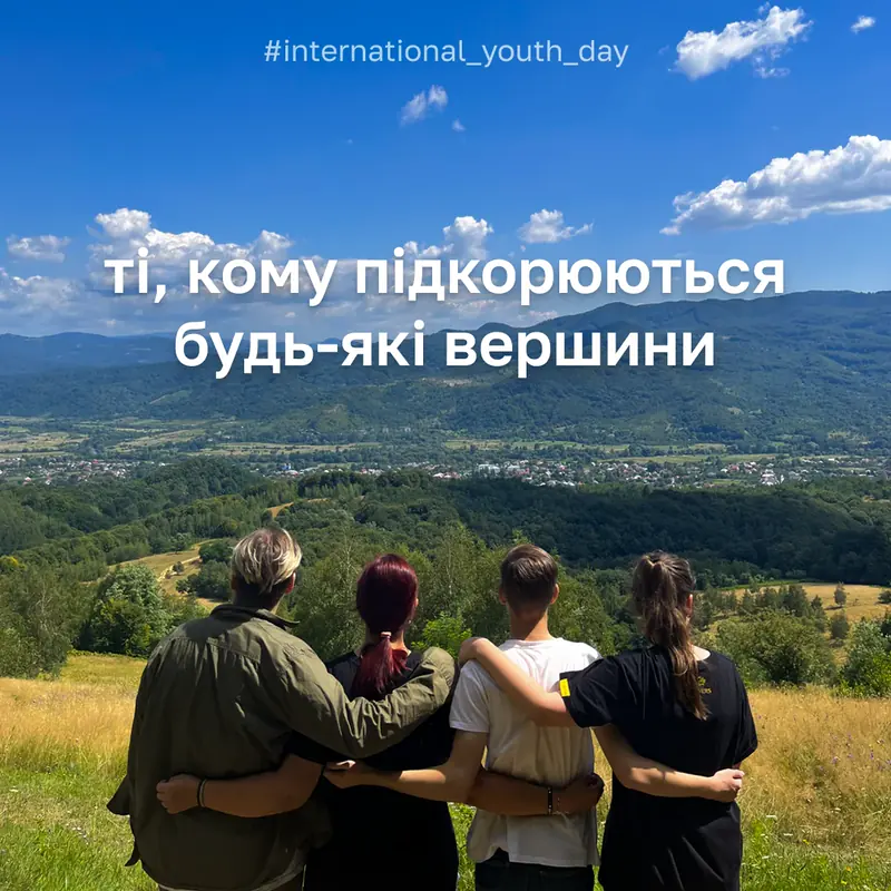 A post for youth day: four people seen from behind with their arms around each other on a green hill, with a line of text across the sky.